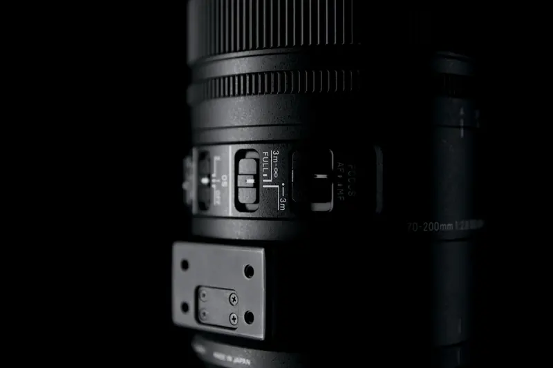 Focus limiter switch on the Sigma 70-200mm f/2.8 Sports, with the tripod foot removed
